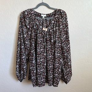 Long sleeve, loose blouse. Never worn. Size 1X.